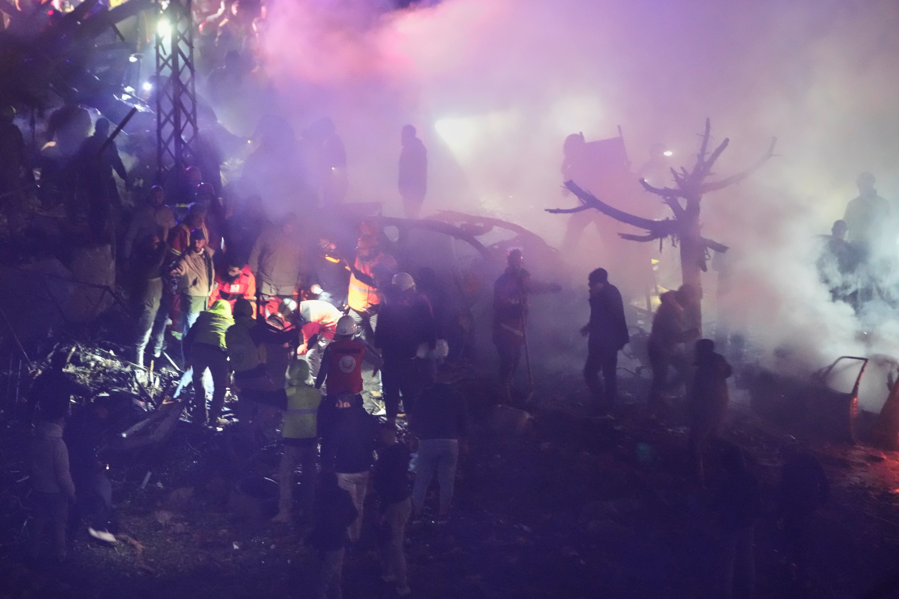 Rescue workers inspect the scene of Israeli airstrikes, in Beirut, Lebanon