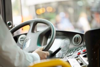 Bus drove off with taxi driver clinging to doors after road rage incident
