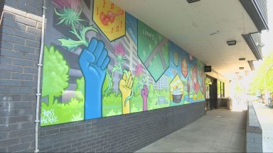 New community mural brings colour and local stories to shopping centre