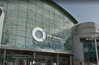 Man reported in connection with ramming car into shopping centre in armed robbery