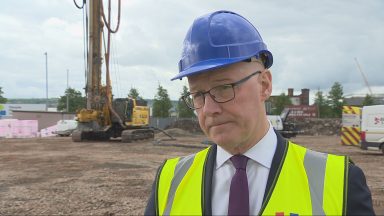 First Minister John Swinney to look at football banning orders and pitch invasions following title disorder