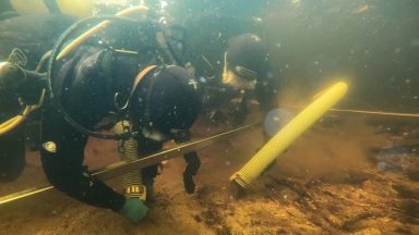 Wooden platform found hidden under Neolithic artificial island in loch