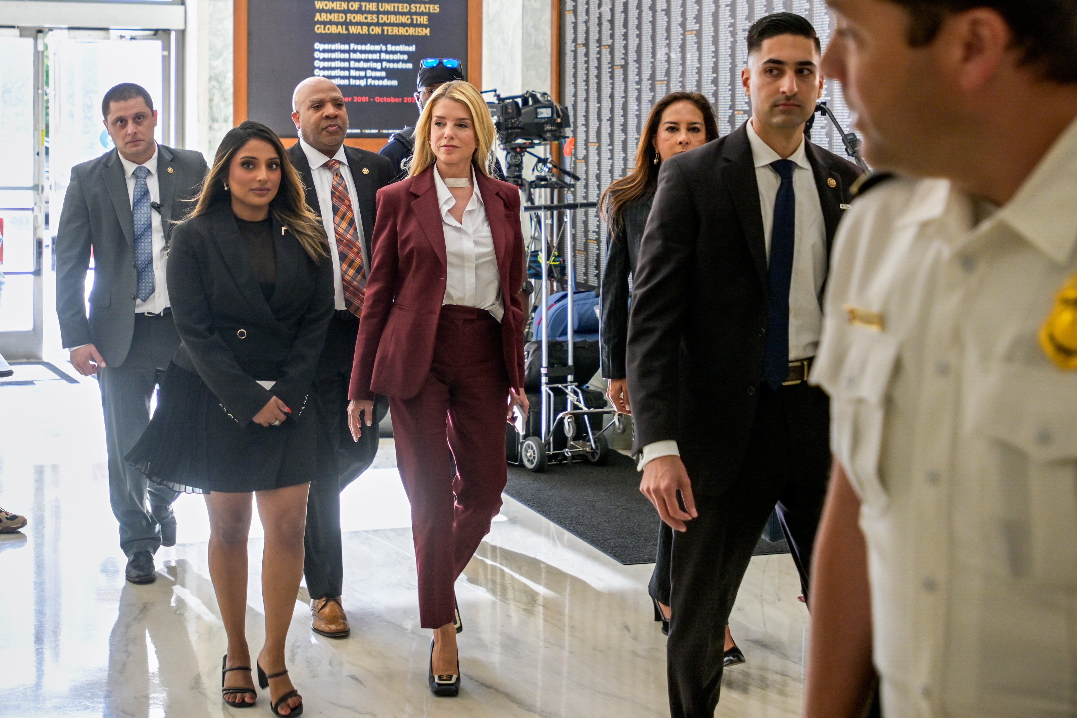 Pam Bondi arrives for her deposition