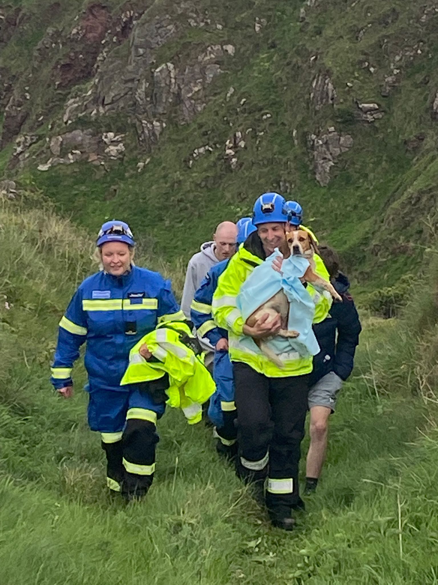 Rescuers made their way to the area to meet the dog's family