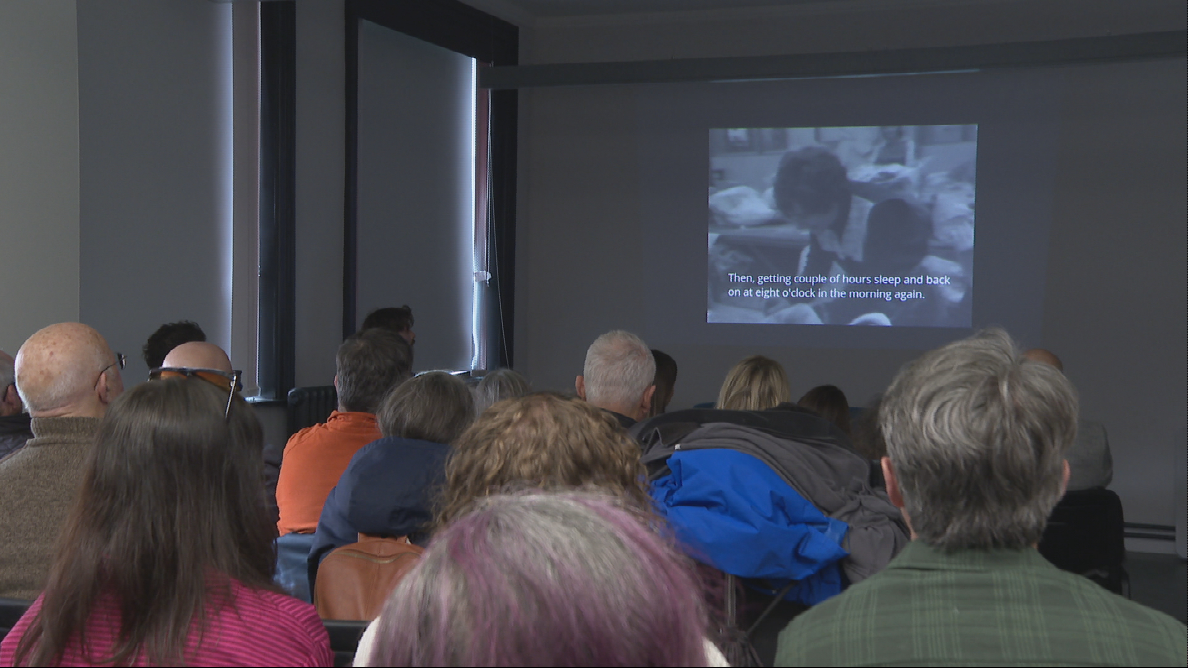 Locals watch films at a community screening