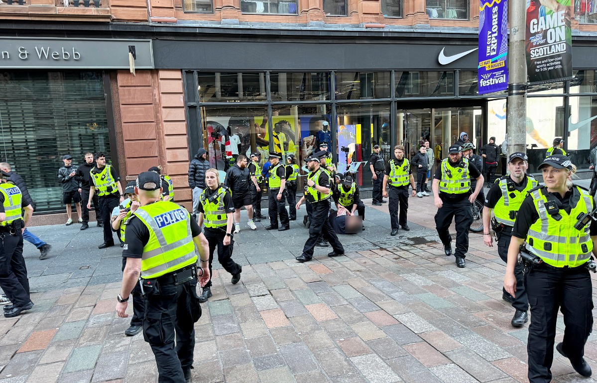 Police descended on Glasgow on Tuesday evening as crowds of people dressed all in black gathered in the city centre.