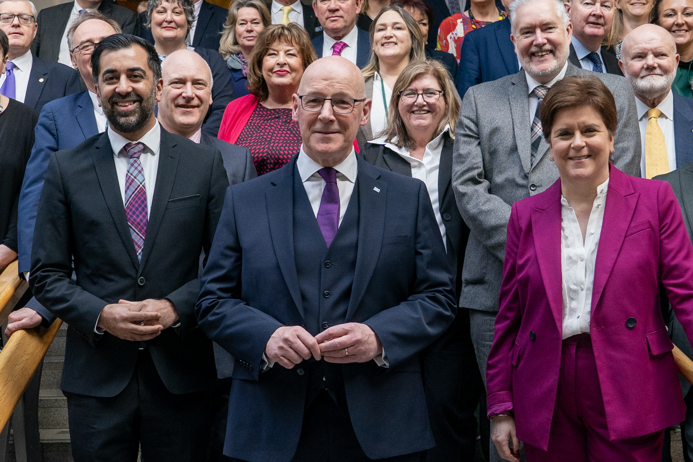 Humza Yousaf, left with his successor as first minister, John Swinney, and former first minister Nicola Sturgeon (Jane Barlow/PA)