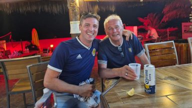 Scotland fan in disguise surprises dad after flying out to Miami