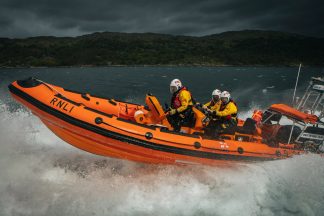 Teenager sails out on own boat to rescue two men who got into difficulty in water off the Isle of Skye