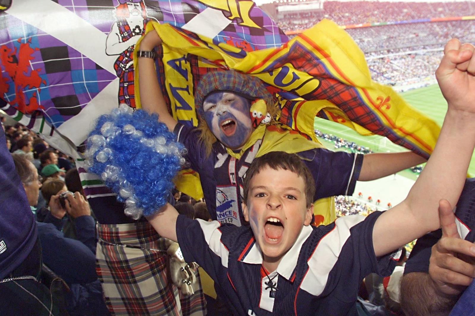 Scottish fans cheer in the stand of Stade de France in St.Denis, northern Paris during the opening ceremony of the 1998 World Cup.