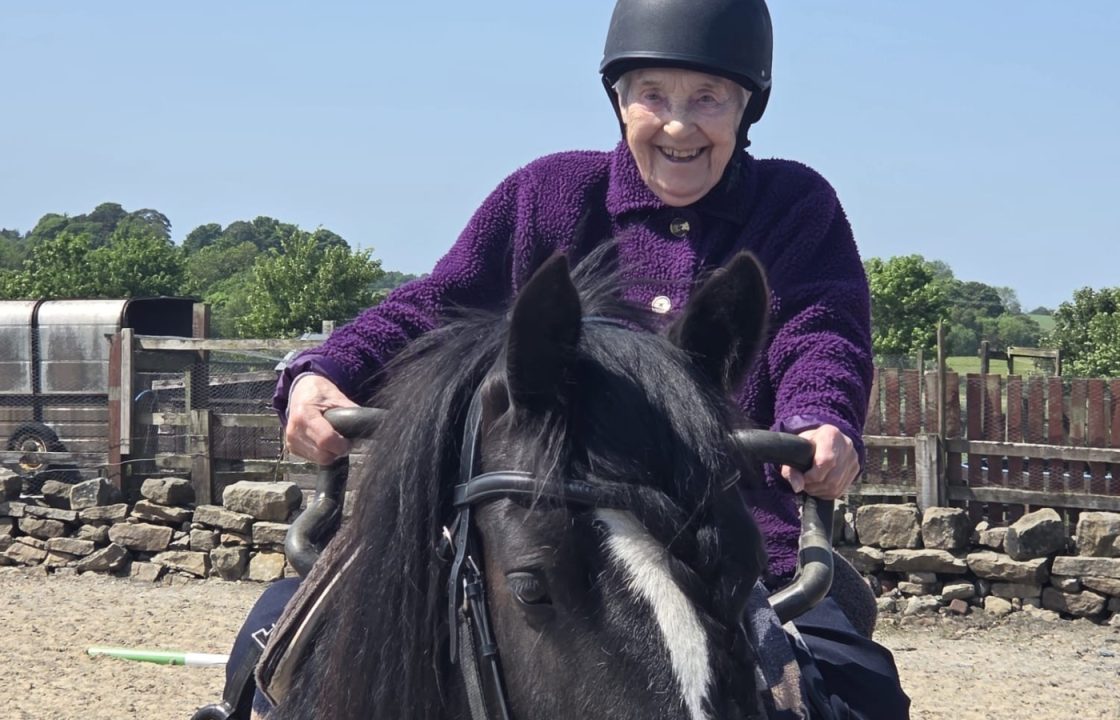 Care home resident fulfils dream of riding a horse for first