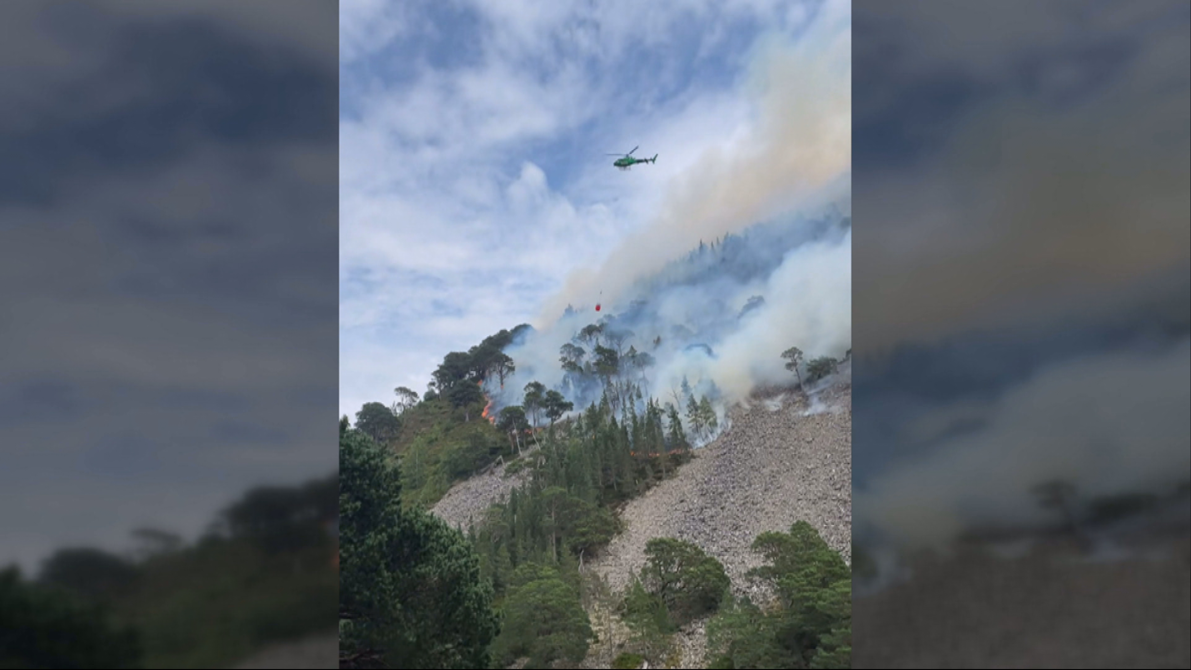 A helicopter used to 'water bomb' fire-ravaged woodland