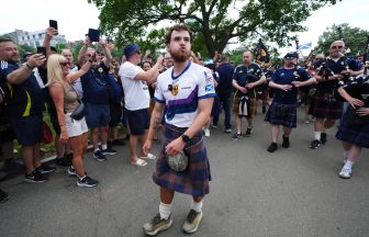 Tartan Army fan who raised £1m for charity in 3,000-mile US walk returns home
