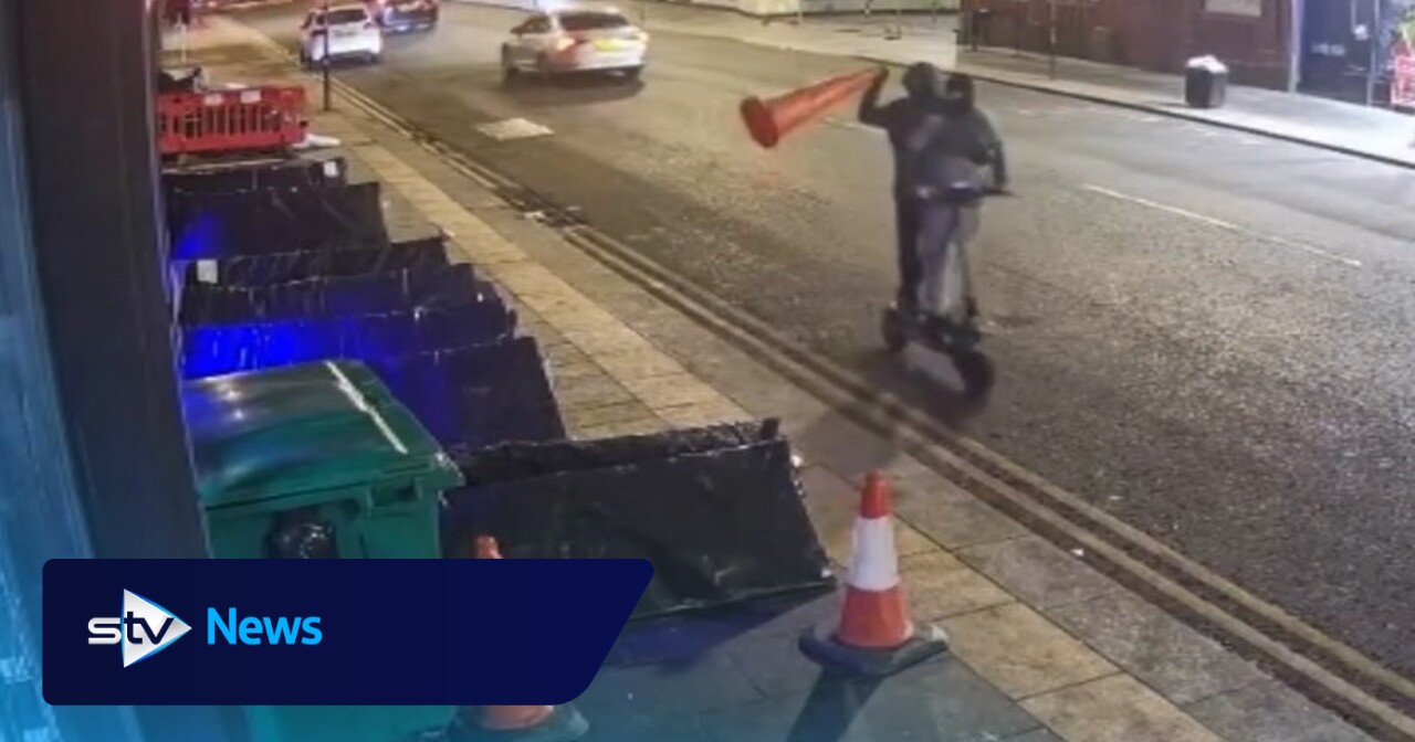 Two masked men on e-scooter throw traffic cone at rough sleeper in Glasgow