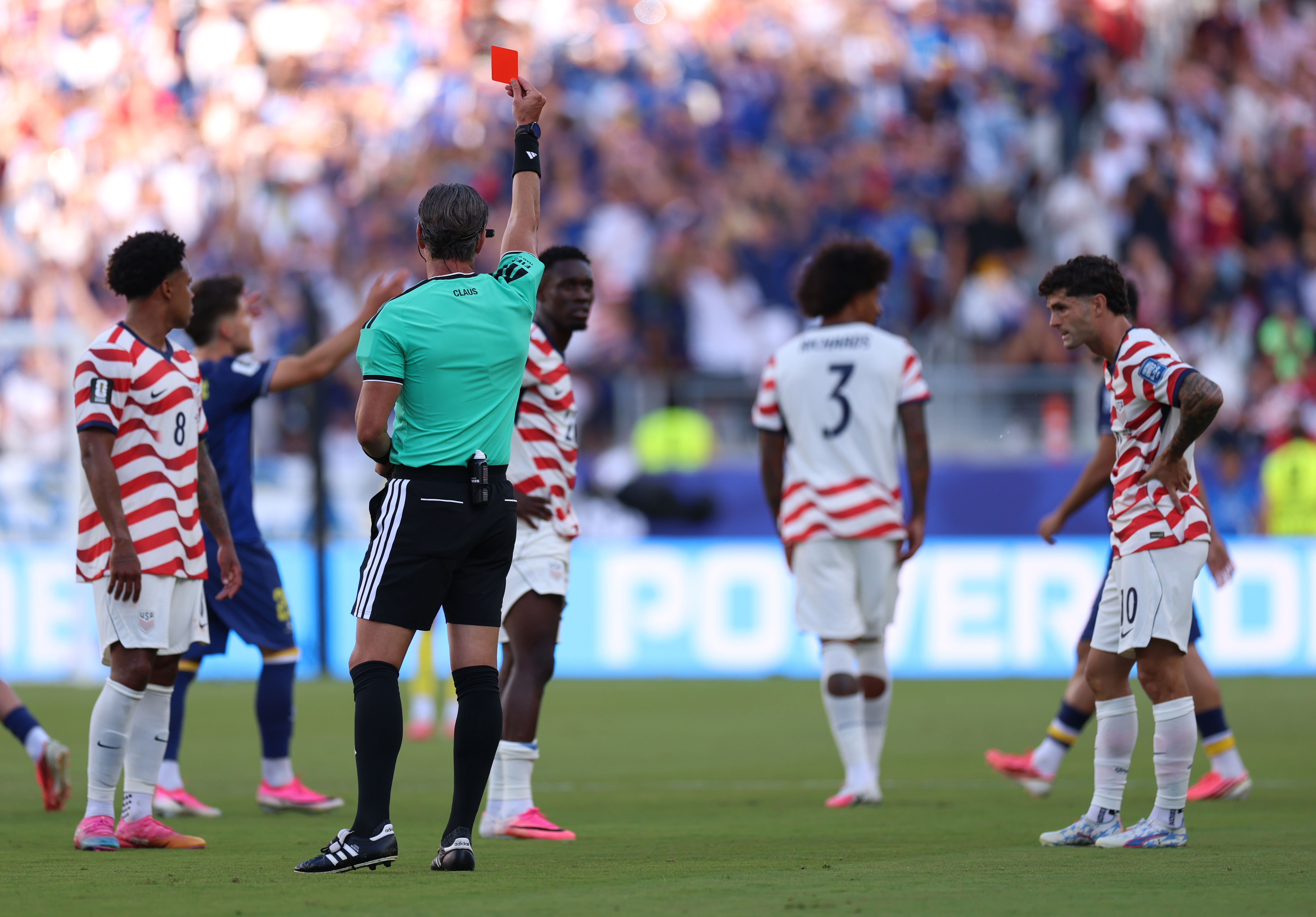 Referee Raphael Claus shows Folarin Balogun #20 of the United States a red card for a foul on Tarik Muharemovic #4 of Bosnia and Herzegovina during the FIFA World Cup 2026 Round of 32 match between USA and Bosnia and Herzegovina at San Francisco Bay Area Stadium on July 1, 2026