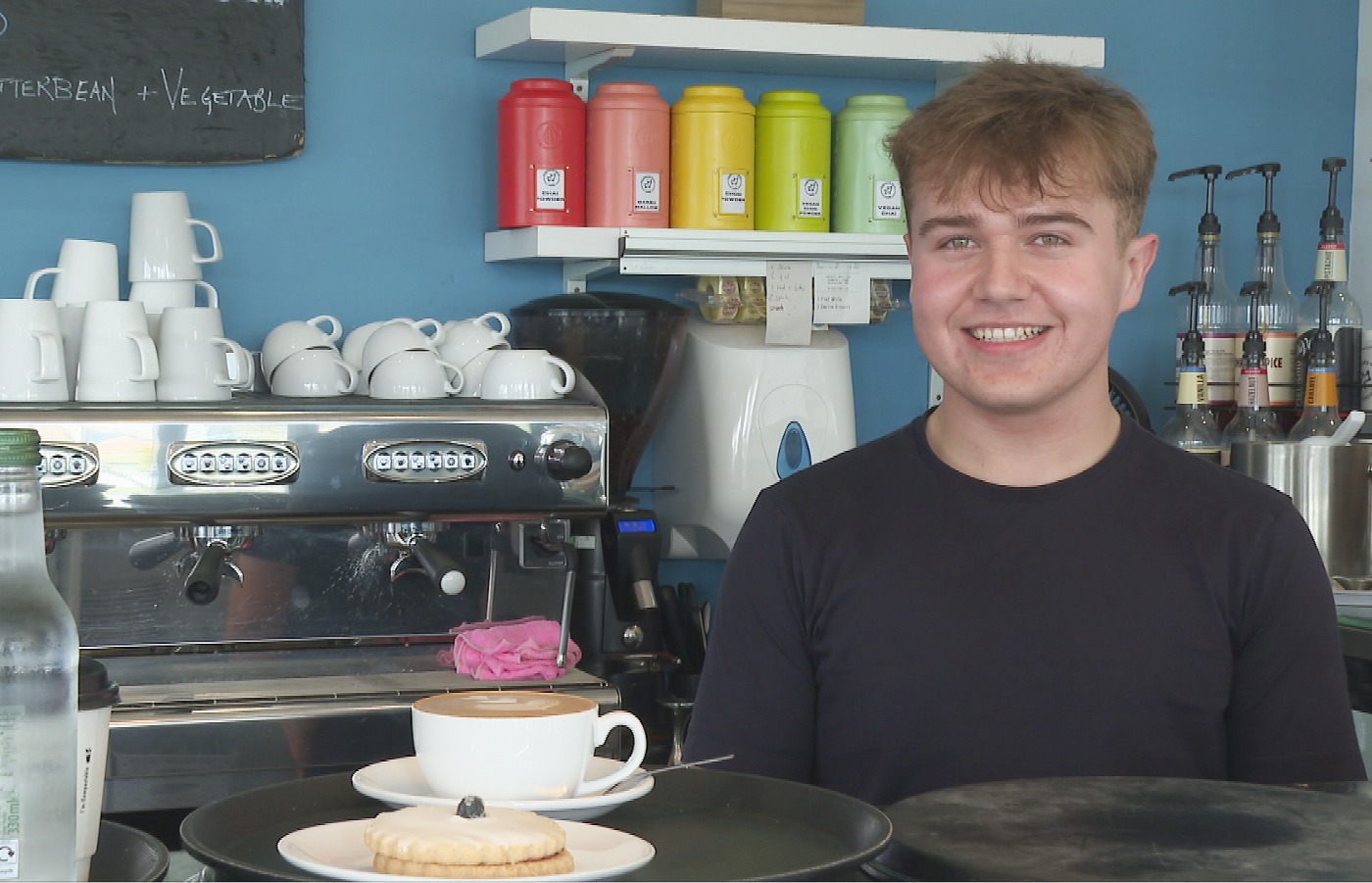 Euan Lonnen was captured on CCTV at the cafe where he works, dashing into the driverless vehicle to slam on its brakes to avoid disaster.