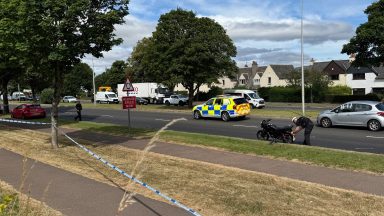 Pedestrian in hospital after being struck by motorcycle as road closed
