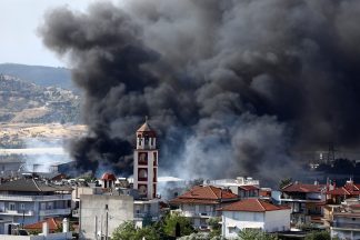 Hundreds of firefighters deployed to battle wildfires in Portugal and Greece
