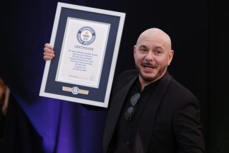 Pitbull recognised for largest gathering of people in bald caps by Guinness World Records