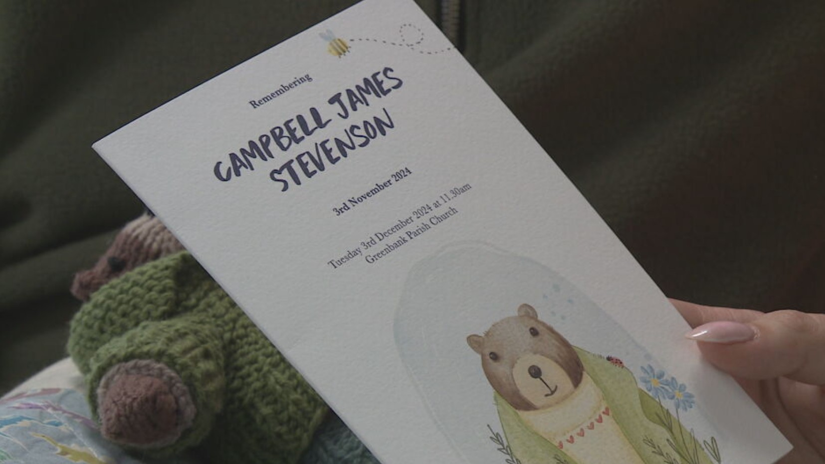 Clare holds the Order Of Service for Campbell's funeral