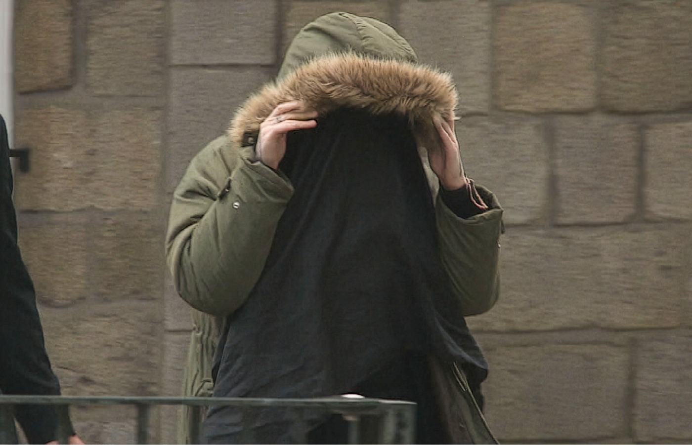 Courtney Gartshore covered her face as she attended her trial.