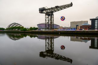 Charles Rennie Mackintosh-inspired Commonwealth Games artwork hung from Finnieston Crane