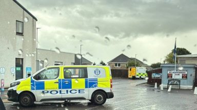Fife street cordoned off after man found dead in vehicle
