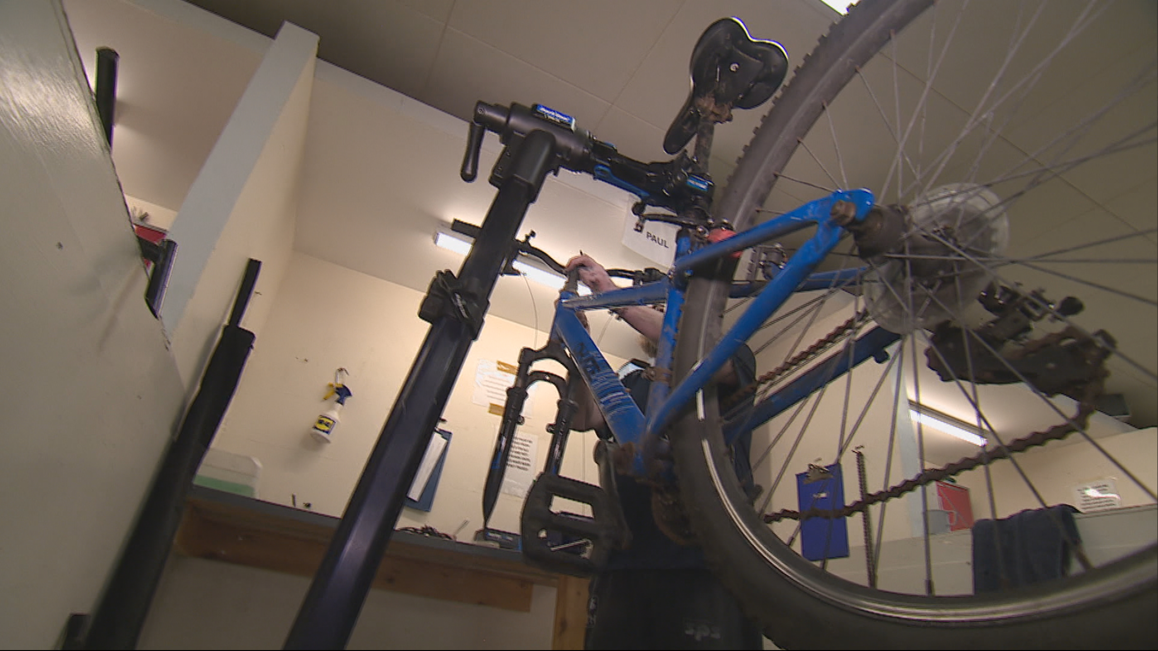 Inmate refurbishing a bike in the prison workshop