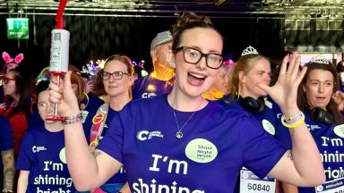Young cancer survivor from Glasgow leads inspirational walk through home city