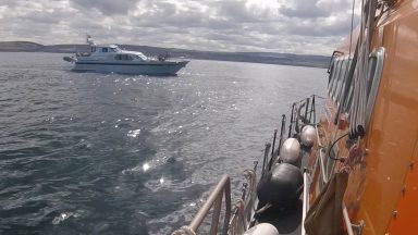 Family sailing around Britain rescued from yacht off Scots coast