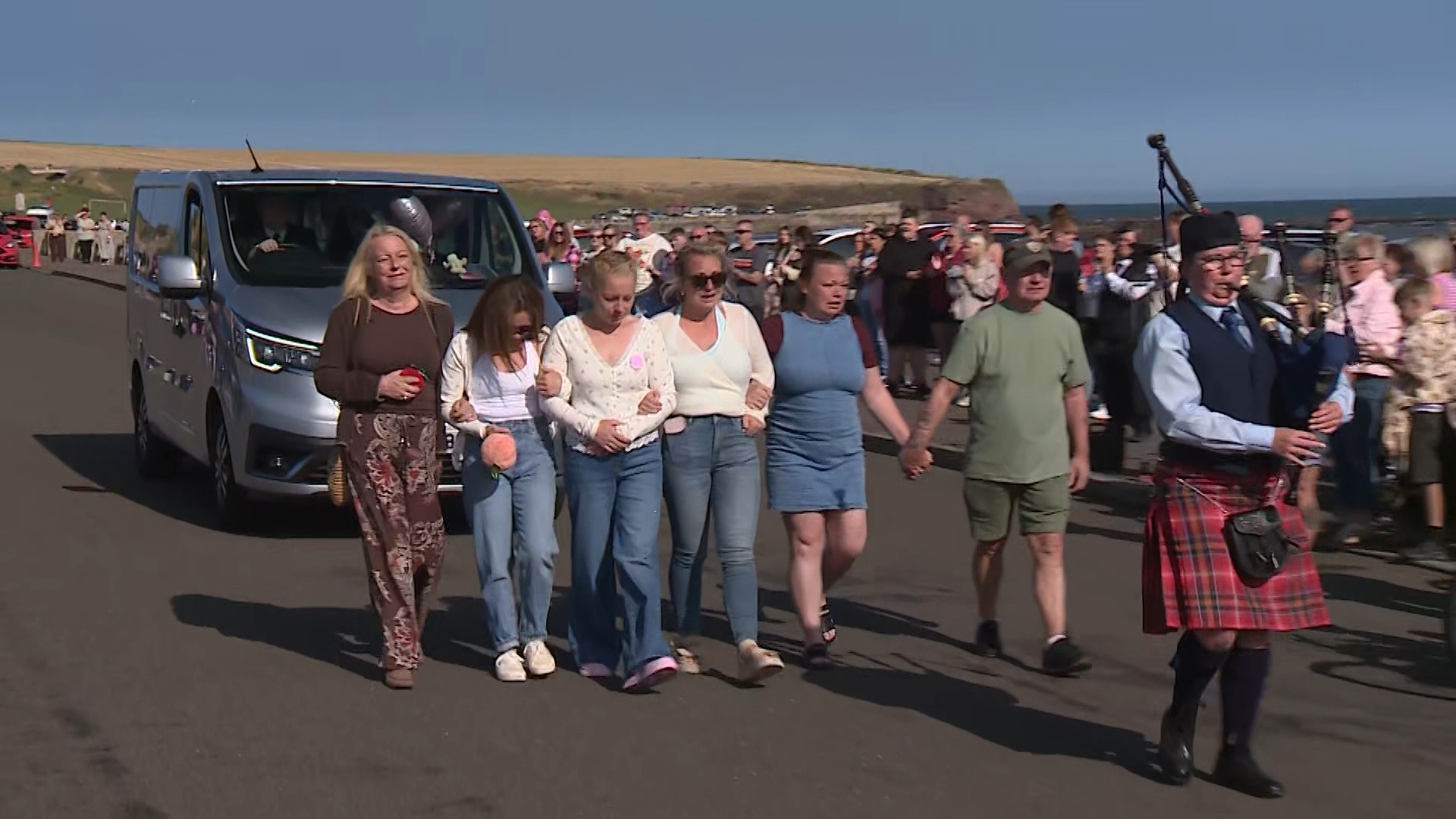 Laurie Merriman walked ahead of the vehicle during the memorial for her daughter.
