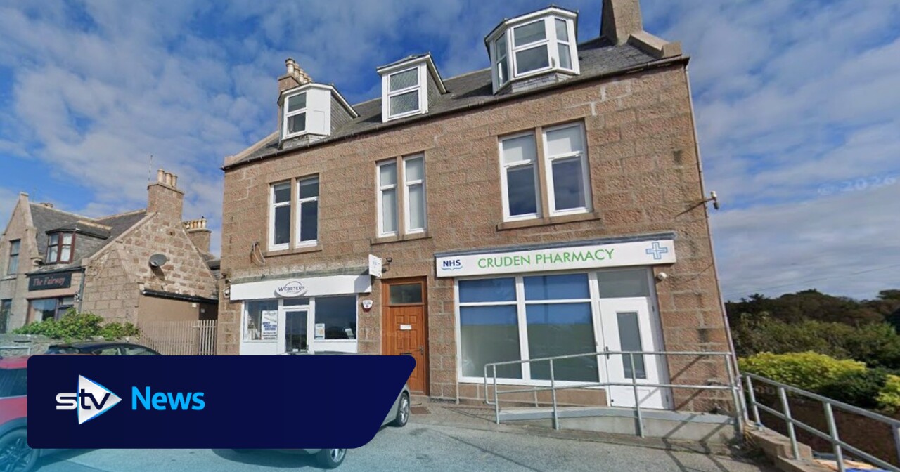 Person in hospital after car crashes through pharmacy window