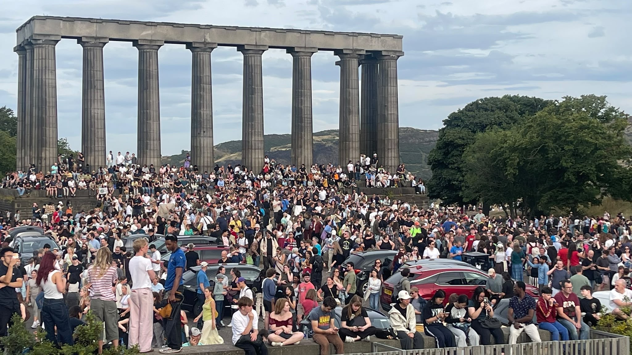 Crowds gathered at Calton Hill in Edinburgh to watch the eclipse.