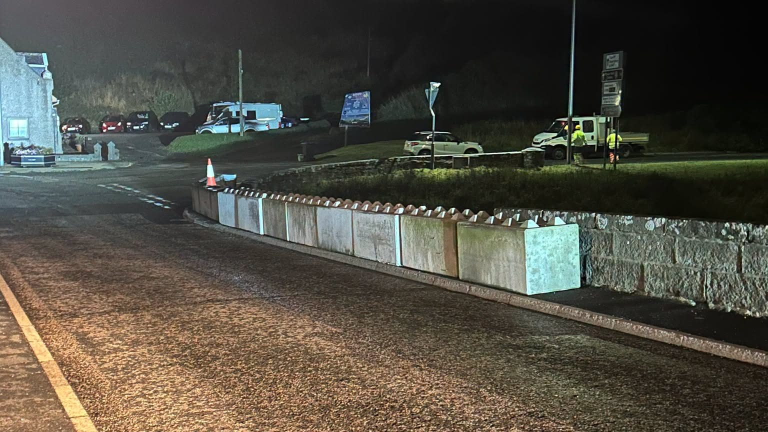 Concrete barriers to protect traffic over the bridge.