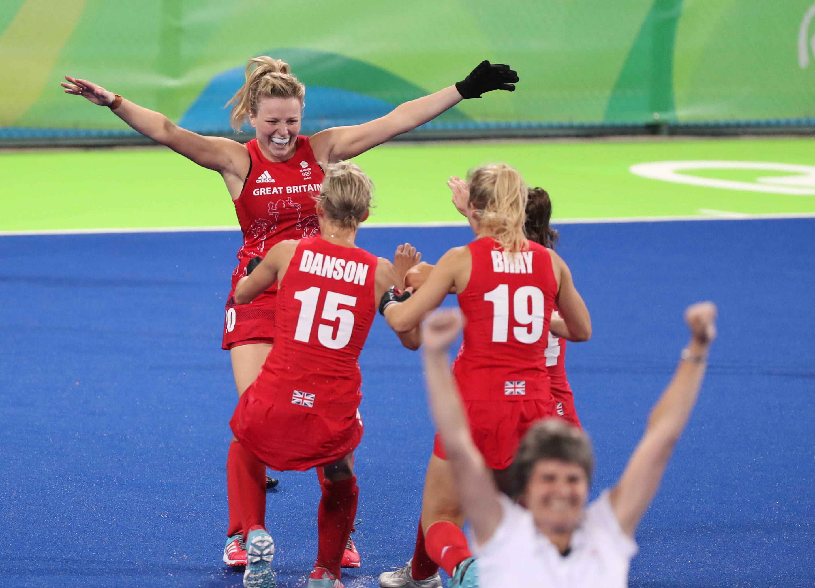 Great Britain's Hollie Webb celebrates with team-mates after scoring the winning goal in the penalty shootout during the gold medal match against Netherlands.