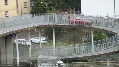 Car spotted driving down pedestrian bridge over the M8 motorway in Glasgow