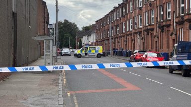Two in hospital after ‘disturbance’ as police close road