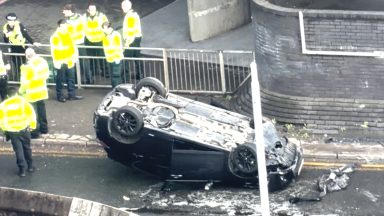 Two taken to hospital and woman charged after crash near Anderston Cross