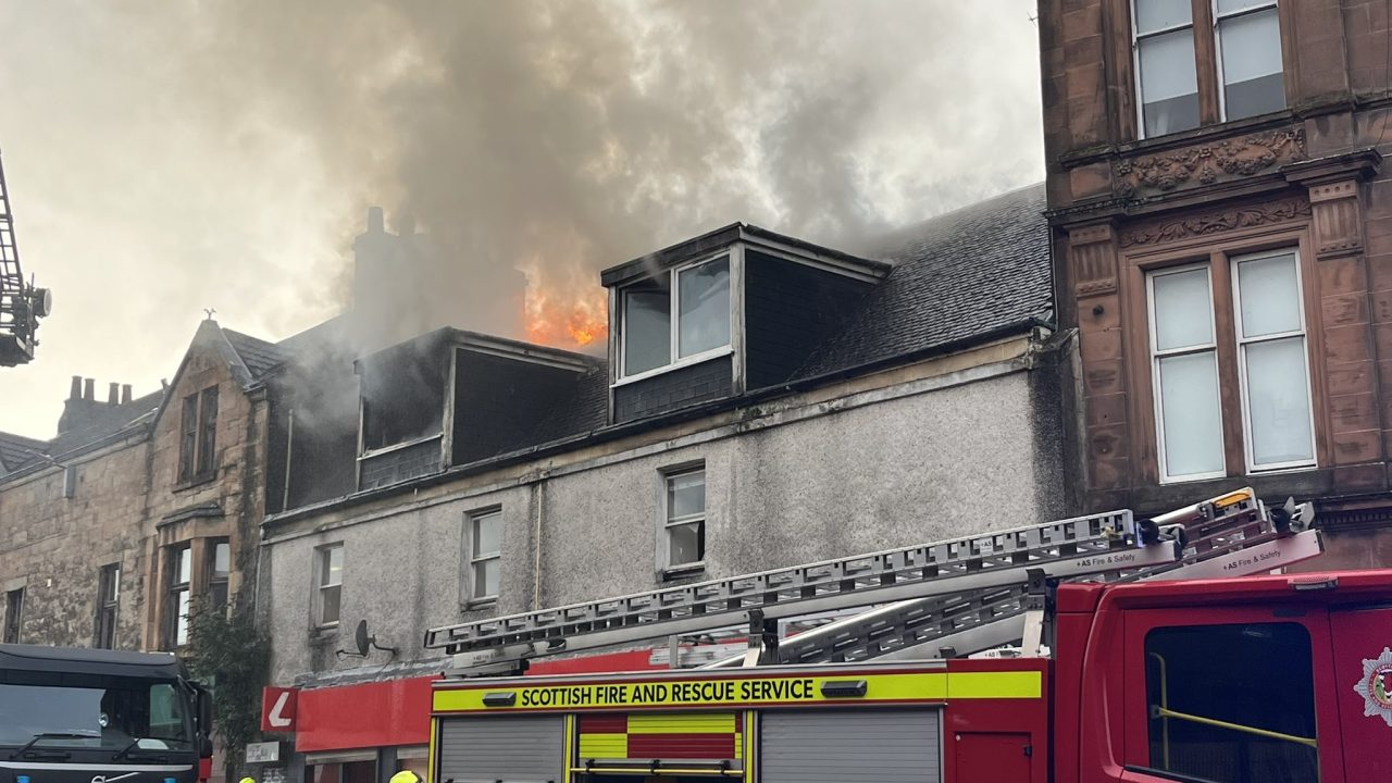 Fire crews tackle building fire near shopping centre in Glasgow
