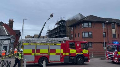 Fire crews remain on scene following fire at Glasgow tenement