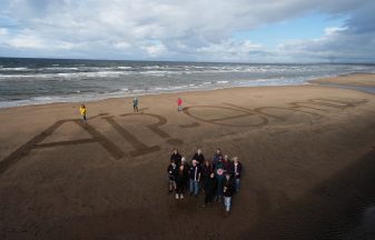 Activists write ‘naw’ to AI on beach as execs set to fly in for summit with King