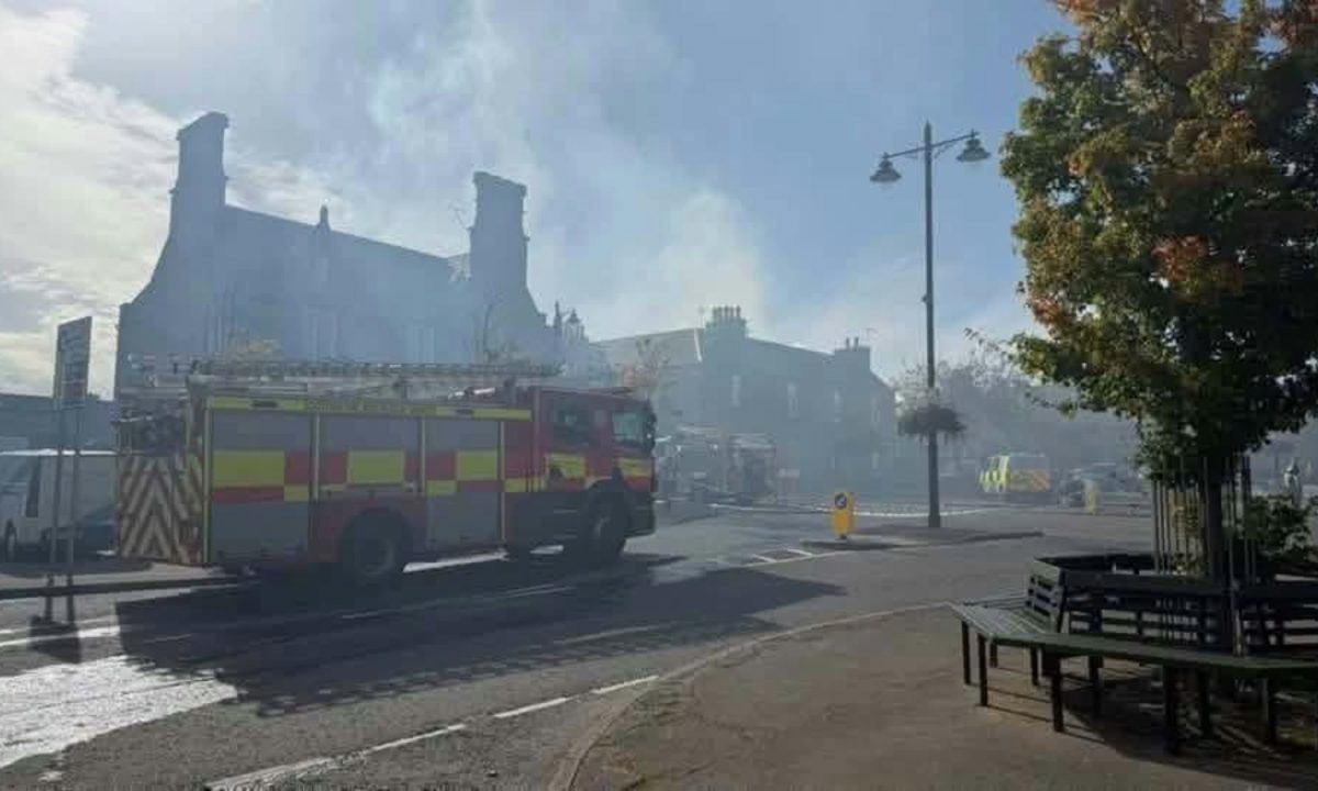 Firefighters tackle ‘well-alight’ blaze in sheds outside property as homes evacuated