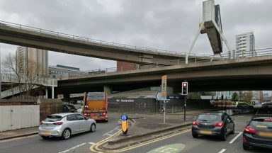 Two taken to hospital and woman charged after crash near Anderston Cross