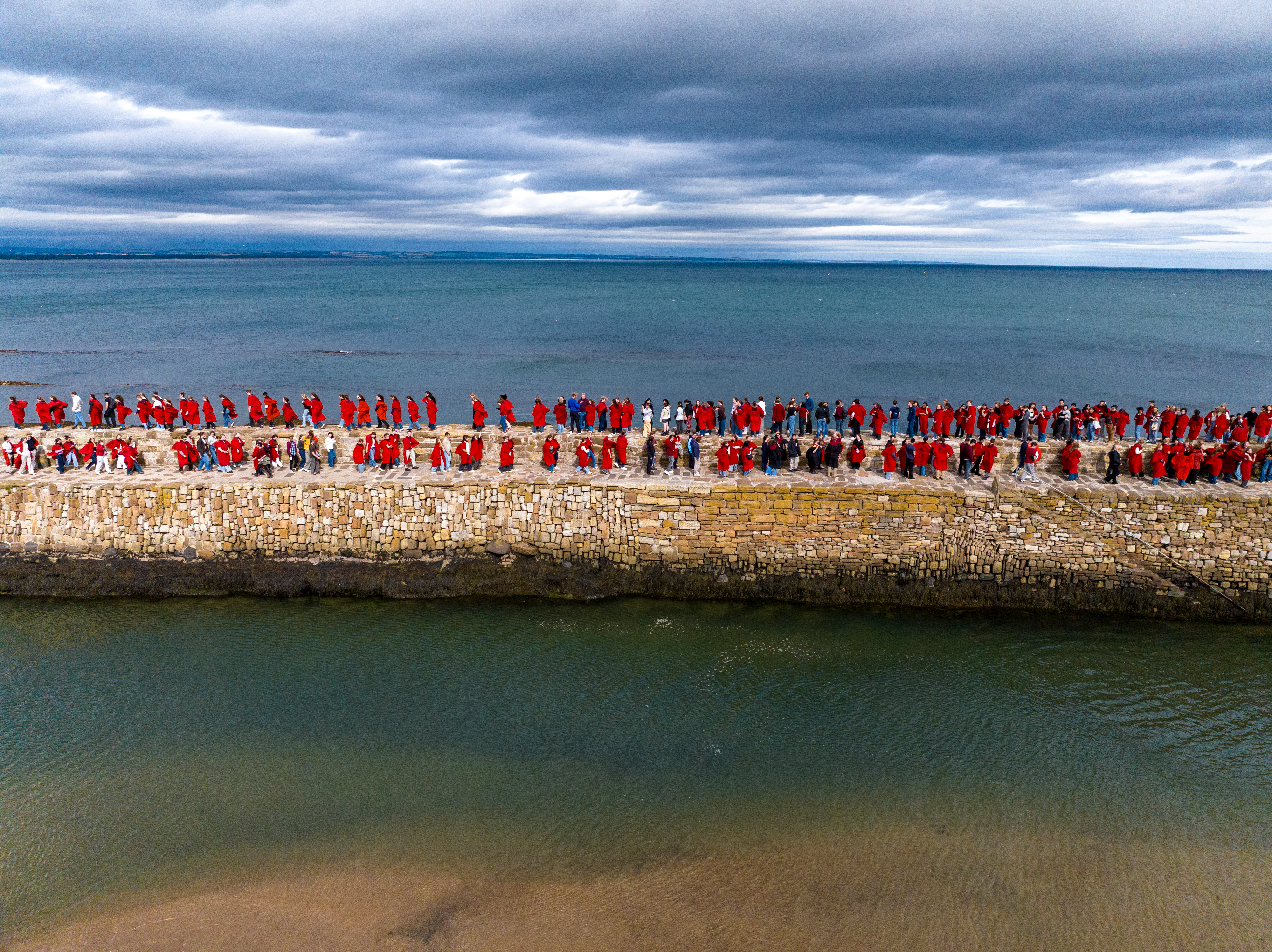 University of St Andrews students take part in traditional pier walk