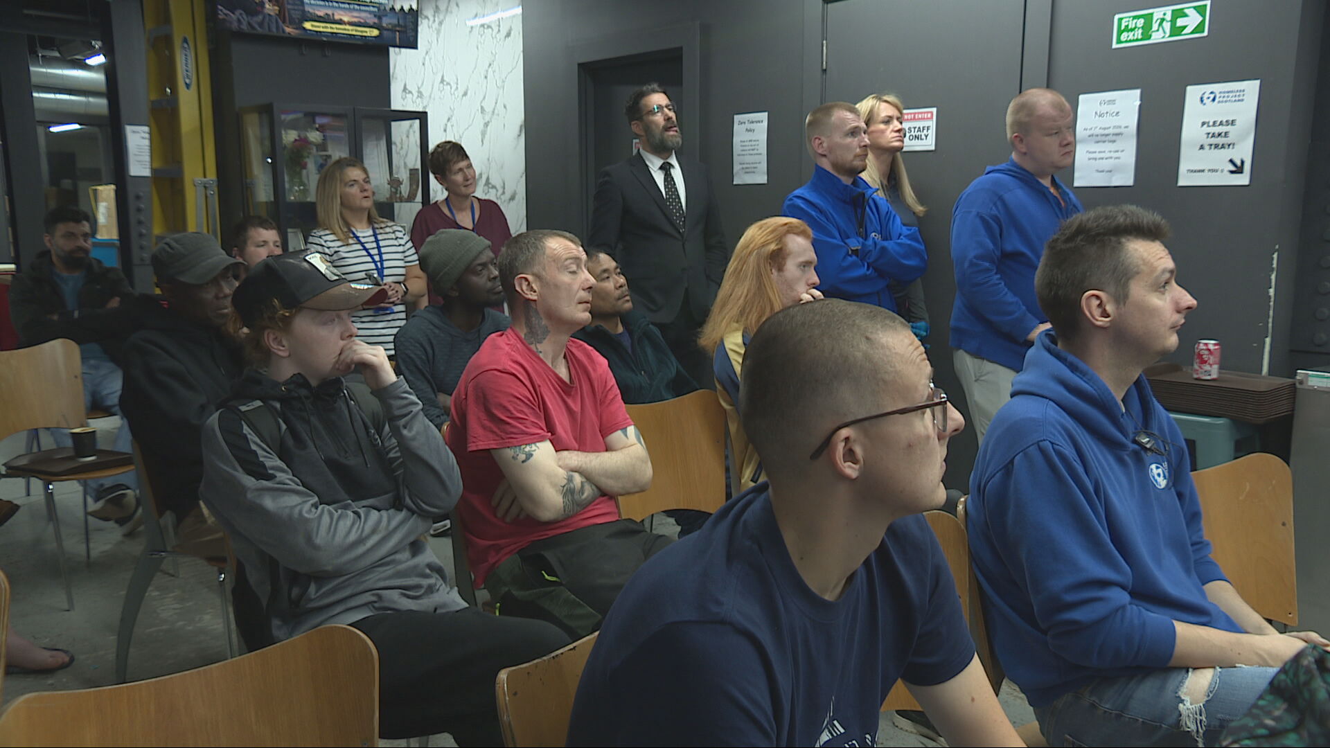 Volunteers wait for the councillor's decision on the night shelter.