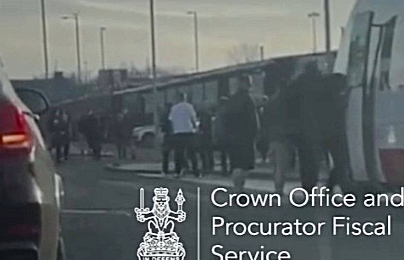 Rangers fans attack a Celtic supporter outside Ibrox.