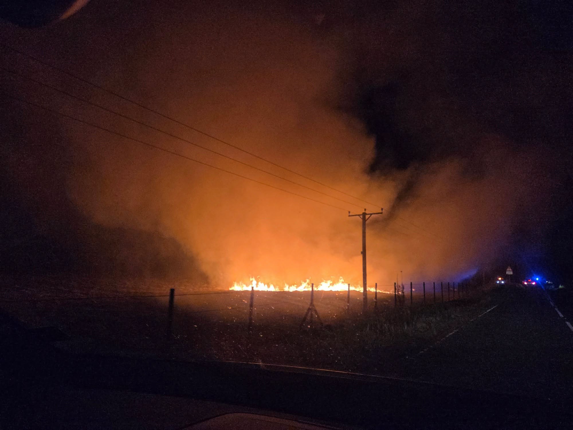 Fire within a field near Burleigh Castle
