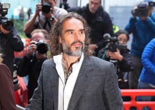 Russell Brand arrives at court for start of rape and sexual assault trial