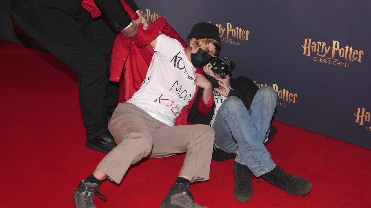 Trans rights activists rush carpet before Harry Potter And The Cursed Child show