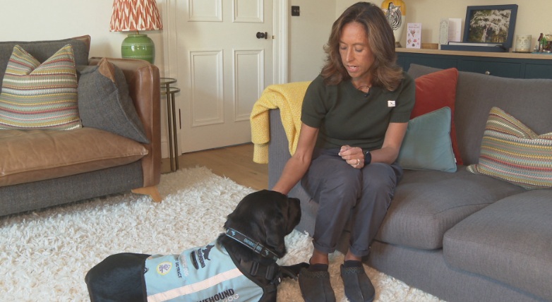 Nancy alongside her assistance dog, Joan